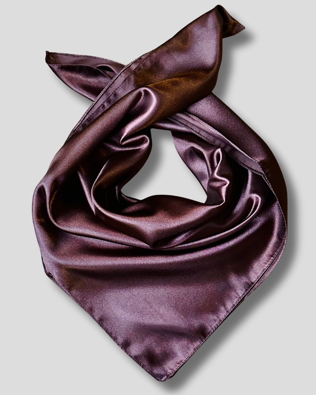 Brown satin scarf on a light gray background