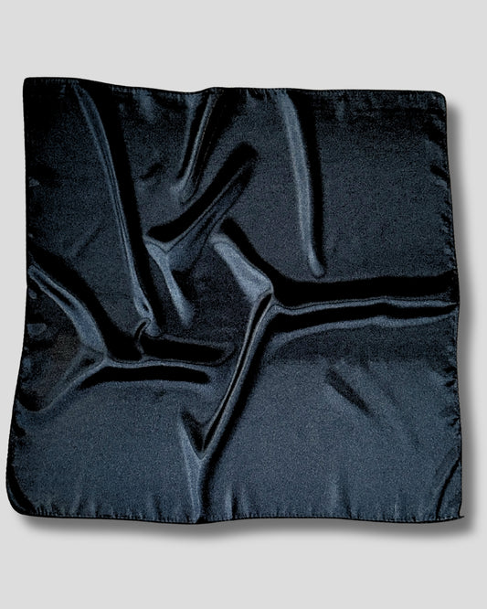 Black satin scarf fabric on a light gray background