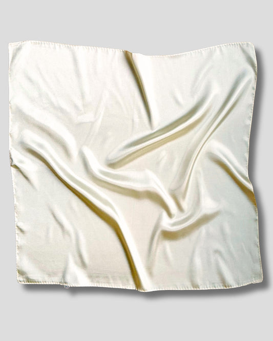 White satin square scarf on a gray background