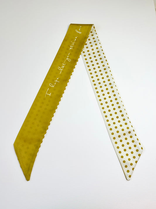 ribbon scarf with text and gold polka dots, on a white background.