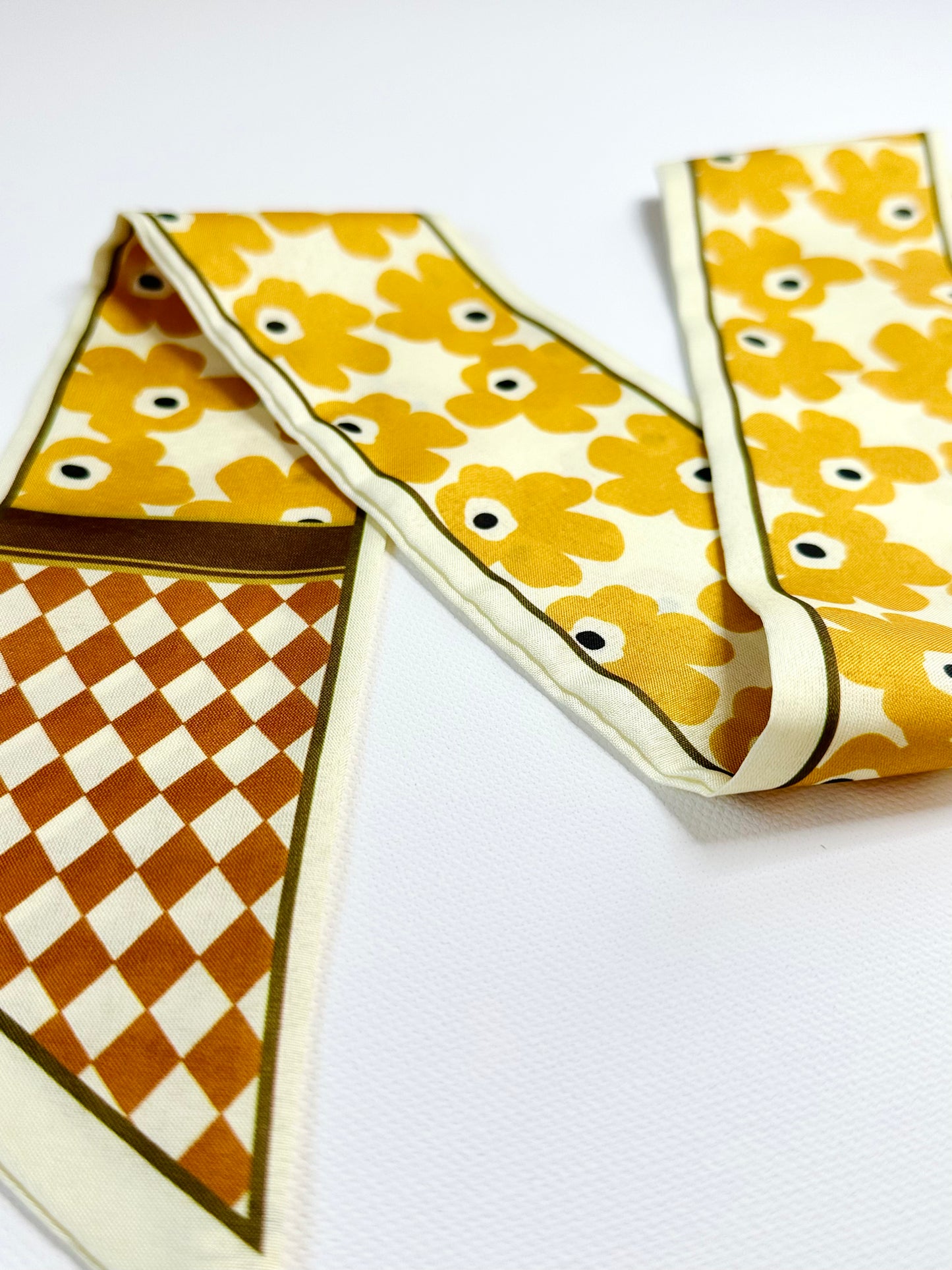Patterned ribbon scarf on a white background