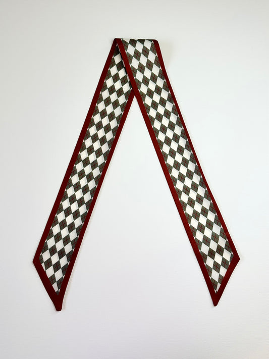 Checkered pattern and red border scarf on a white background