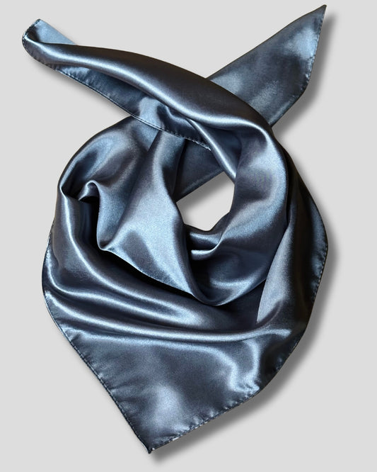 Gray satin scarf folded on a light gray background