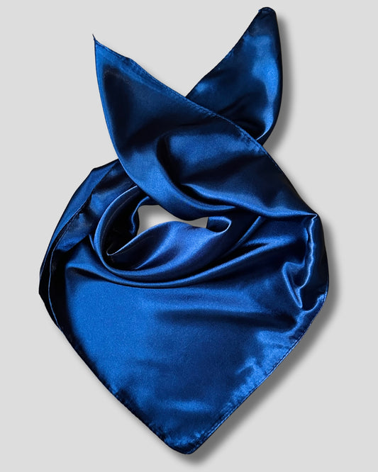 Blue satin scarf on a light gray background