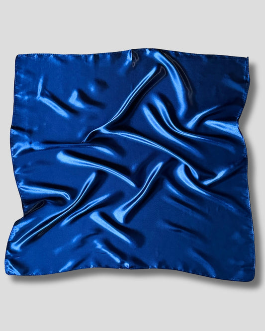 Blue satin square scarf on a light gray background