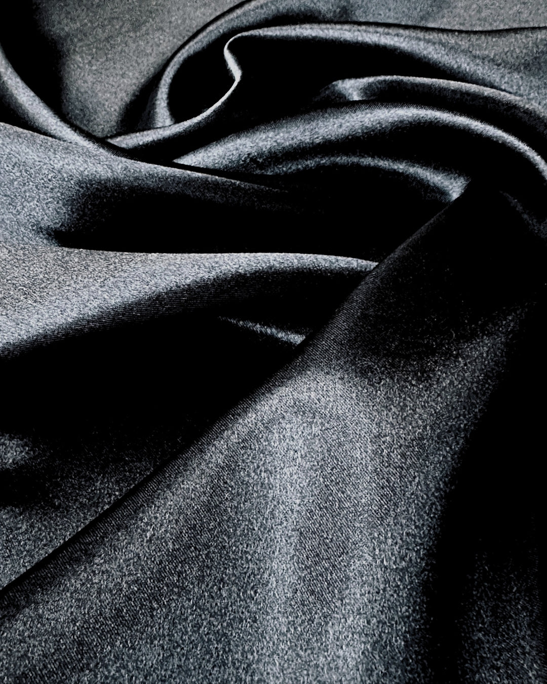 Close-up of black scarf fabric with folds