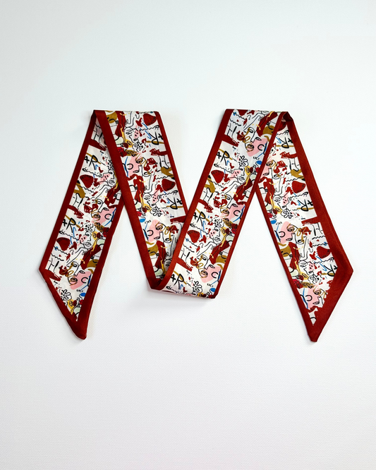 Decorative ribbon scarf with a festive pattern on a white background